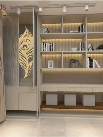 A beautiful study and library nook with backlit shelves and a peacock feather motif, blending elegance with functionality.