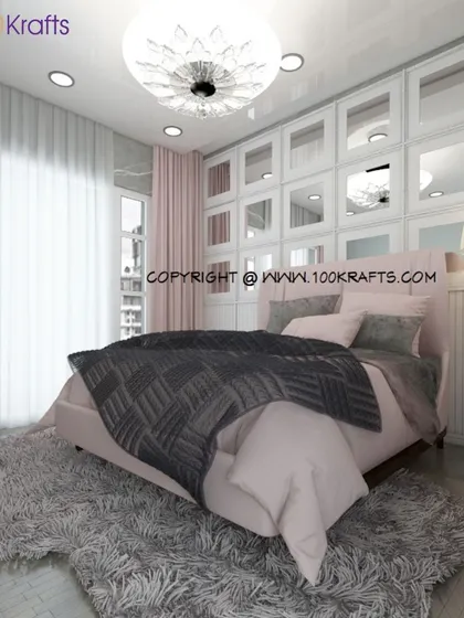 A softer take on gothic style, this bedroom uses a mirrored wardrobe wall, a plush rug, and shades of pink and grey to create a glamorous feel.