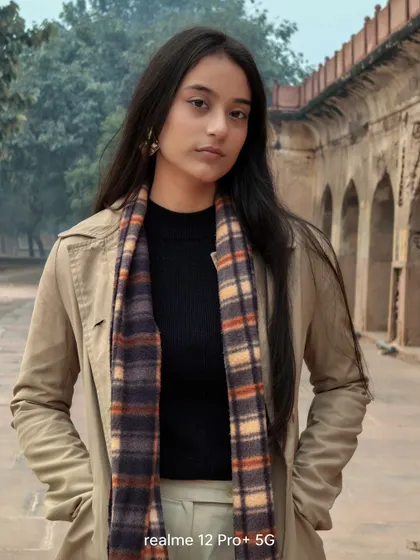 A portrait shot taken with the Realme 12 Pro+ 5G. This demonstrates the phone's camera capabilities in a real-world setting, showcasing its ability to capture sharp subjects with a pleasing background blur.