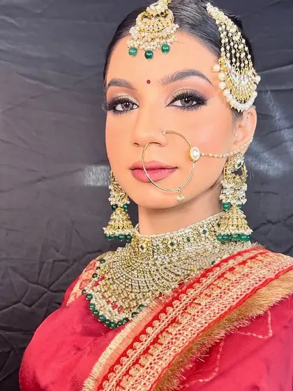 A close-up of a look taught to my pro batch students. This showcases a classic bridal style with golden shimmery eyes, a sharp wing, and a perfectly defined nude lip.