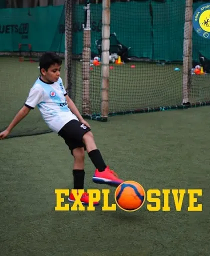 A young player demonstrates explosive power in his kick. I help athletes channel their energy into effective and powerful plays.