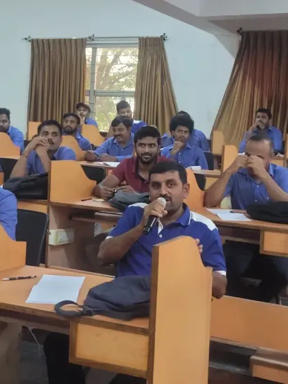 A participant actively engages in a discussion during our English training. Our trainers ensure that every learner is involved, making the sessions more effective and memorable.