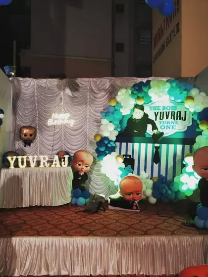 Another angle of the outdoor Boss Baby stage, highlighting the character cutouts and name display.