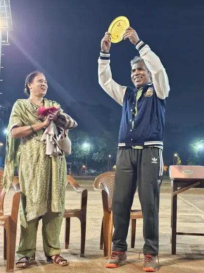 We honor the legends who built this community. A senior member of Chembur YMCA being celebrated on court, a moment of respect for his guidance and support.
