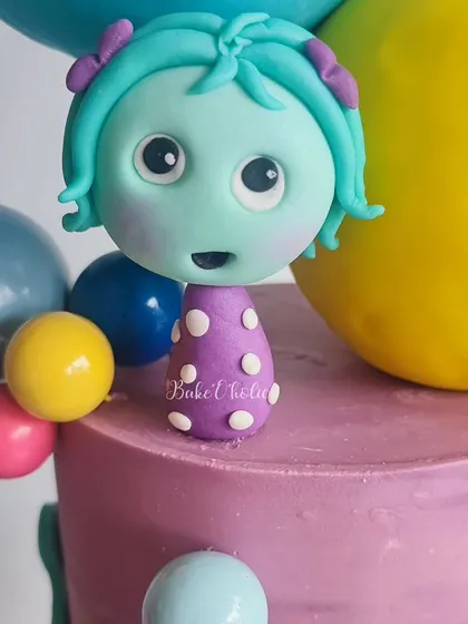 Here's a detailed look at another one of the handcrafted emotion figurines from the 'Inside Out' cake. These little touches are what make a custom cake so magical.