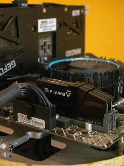 A close-up of the RAM and CPU cooler on a gaming PC motherboard. We use high-quality components in our workshops to give students a real-world building experience.