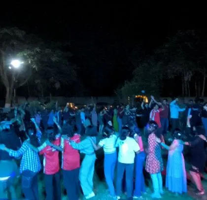 A coordinated dance move at the sports day celebration.
