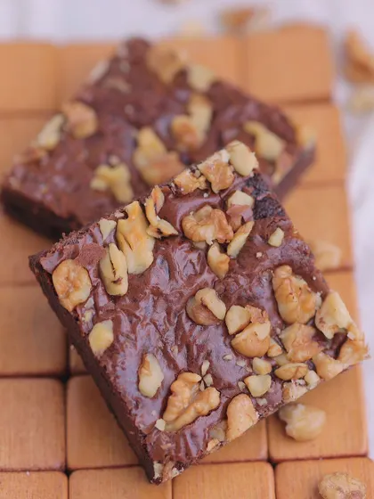 A close-up of the Walnut Brownie, showing how the walnuts are baked into the top, creating a crunchy crust.