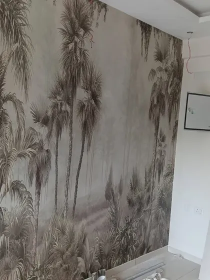 A misty, monochromatic palm tree mural creates a serene and atmospheric feature wall. This design is perfect for adding depth and a sense of tranquility to a living room or bedroom.