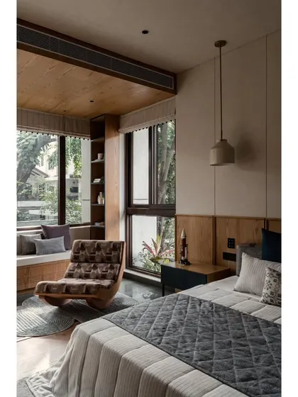 This view highlights the comfortable reading chair and the connection to the window seat. We aimed to create different zones within the room for various activities.