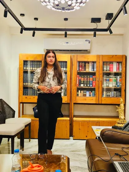 In my office, surrounded by the tools of my trade. For every first-generation lawyer, the key is to survive and never surrender. Your hard work will pay off.