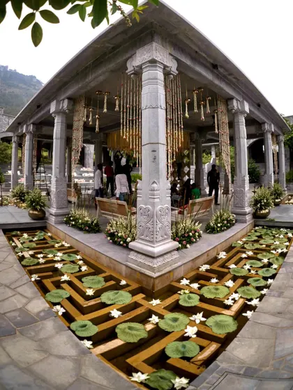 Set against the Nandi hills, this majestic stone mandap needed only a touch of our magic. We used delicate floral chandeliers and floating water lilies to enhance its natural grandeur, creating a truly royal wedding setting.