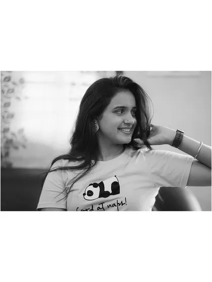 Another candid black and white shot from the same series. Her relaxed pose and the fun graphic on her t-shirt add to the casual, authentic vibe of this lifestyle portrait.