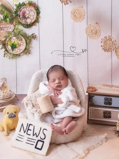 Another view of our little boss, with his newspaper and coffee. The setup is full of fun details that tell a story of a baby who means business.