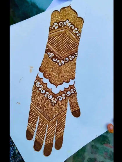 A practice sheet showing a full-hand Pakistani design with multiple sections of detailed net and geometric work.