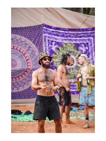 A man juggling in the middle of a festival, completely in his element. These are the small, human stories I love to find and photograph.
