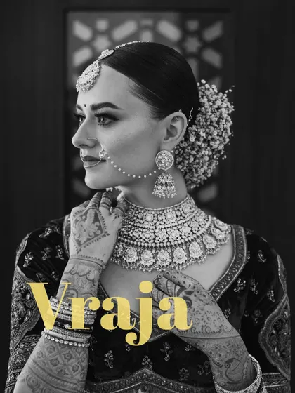 A timeless black and white profile of the bride, Vraja. This classic style accentuates her features, jewelry, and the delicate hairstyle, creating a portrait of classic beauty.
