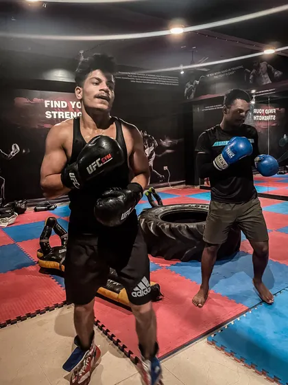 If you want something, you have to learn to fight for it. Here, two of my fighters catch their breath after a tough drill, showing the grit required to train here.