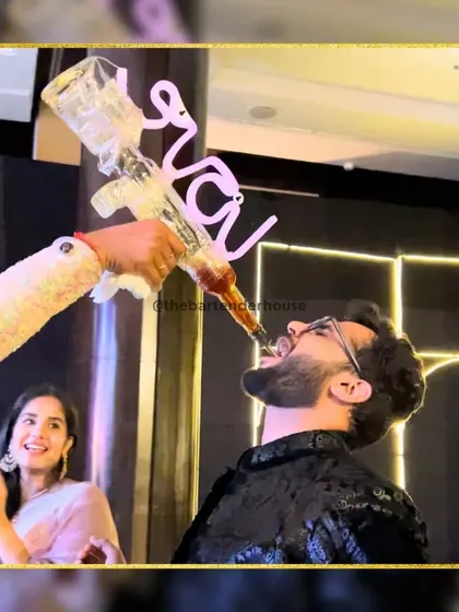 Taking shots to a whole new level. This custom "baraat" bottle is one of our signatures, making for a great photo opportunity and a fun memory for the groom.