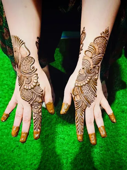 Another view of the fresh Arabic peacock design, showing the clean and precise application.