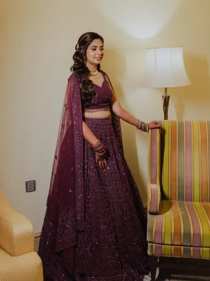 A full length shot of her Sangeet look. The deep purple lehenga is so rich and beautiful.