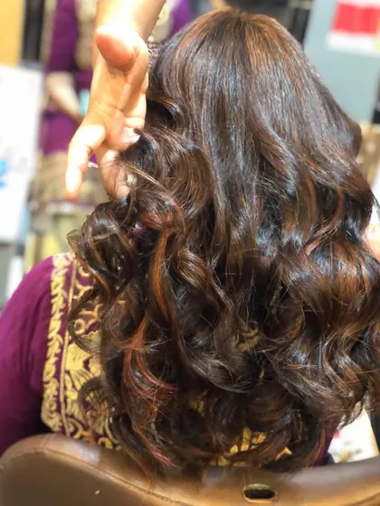 A different angle of the copper and auburn highlights, showing how the light catches the different shades.