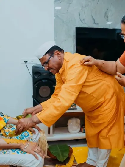 Elders of the family blessing the groom and applying Haldi, a moment rich with tradition and love.