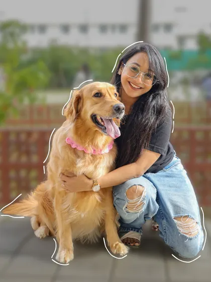 Fun moments at Therpup. A happy guest gives her beautiful Golden Retriever a big hug.