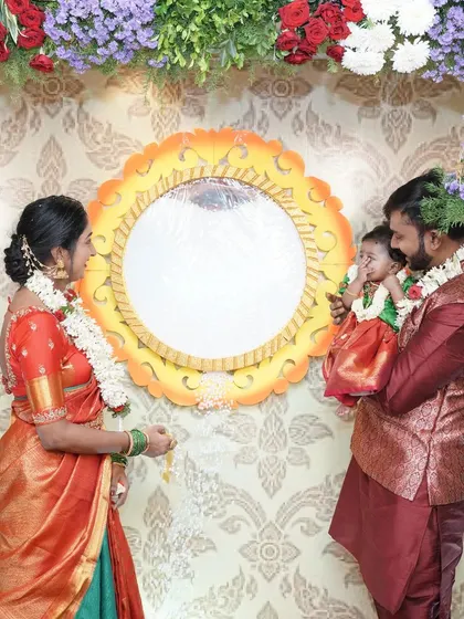 A happy family during a name reveal ceremony. The custom mirror with the baby's name is a unique touch that I was thrilled to create for them.