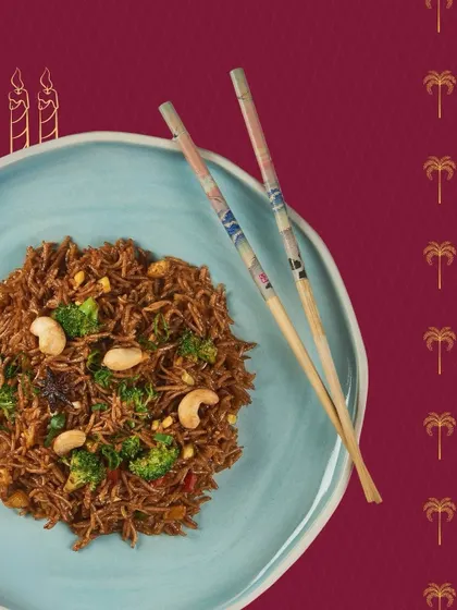 A delicious plate of burnt garlic fried rice with cashews and broccoli. This dish, prepared for a birthday celebration, highlights our ability to create customized and flavourful main courses.