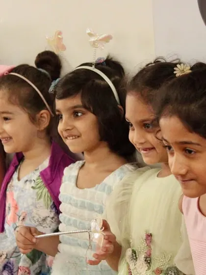 A lineup of smiling faces during our Christmas party. These events are a wonderful way for our students to bond and celebrate together.