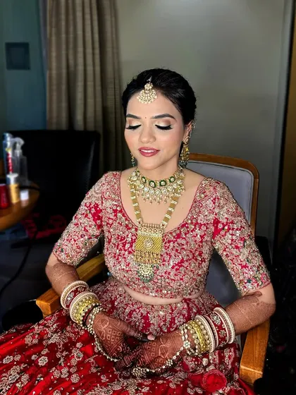A subtle pop of kohl to define the eyes. This look, paired with a red lehenga, is perfect for the bride who wants a touch of tradition with a modern feel.