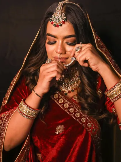 Adjusting the nath, a classic bridal moment. My rental collection includes outfits and jewellery to create your complete traditional look.