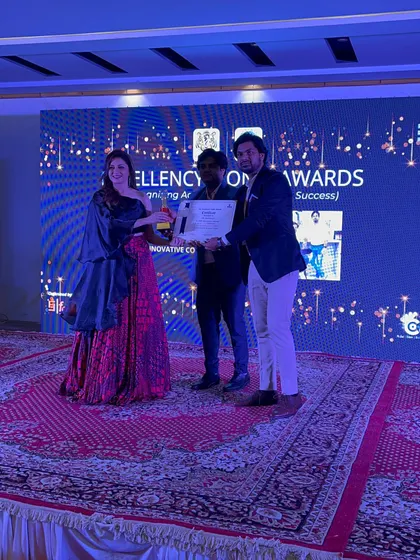 A clear shot of receiving the award, a moment of great pride for our firm.