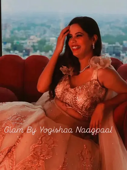 The bride-to-be glowing with happiness during her Roka. This candid shot shows how the makeup looks natural and flawless, even in ambient lighting.