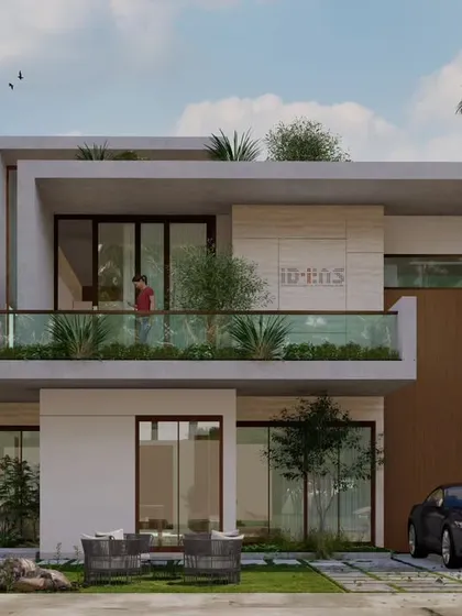 Another view of the Udaipur residence, highlighting the balance between solid white forms, warm wood accents, and the open, airy feel of the glass-railed balconies.