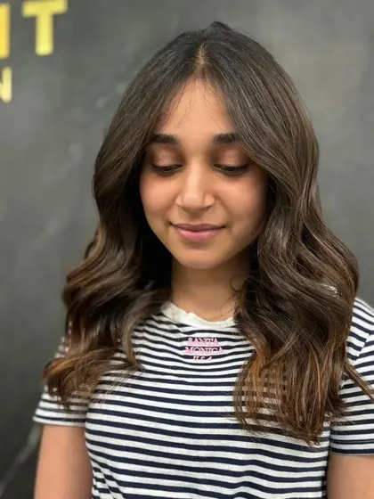 Another portrait of the happy client, her hair perfectly styled.