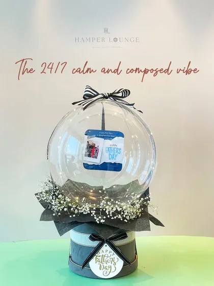 For the dad with a 24/7 calm and composed vibe, this elegant hamper features a personalized photo balloon and a minimalist design.