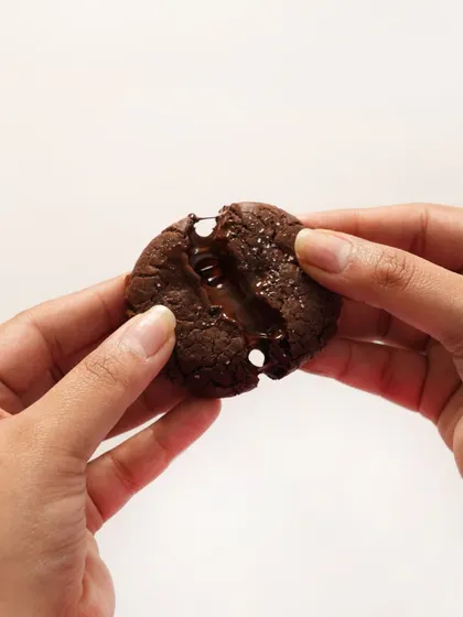 The perfect cheat meal starts here. This image shows the gooey, melted center of my Double Chocolate Chunk Cookie, a truly decadent treat for any chocolate lover.