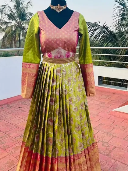 Another angle of the silk gown, showing the V-neck and the traditional border on the sleeves.