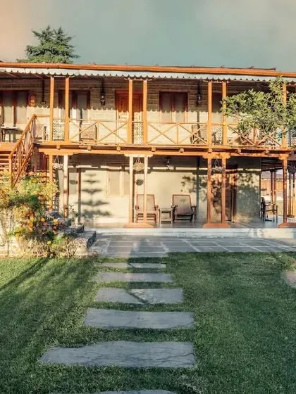 The ground floor veranda and garden path of the Eco Lodge, designed to be a peaceful space for guests to enjoy the outdoors.