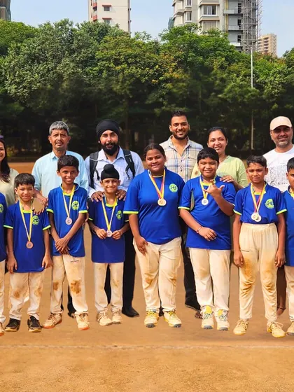 Our young champions with their proud parents and coaches. We believe in a strong support system and celebrate our victories as a community.
