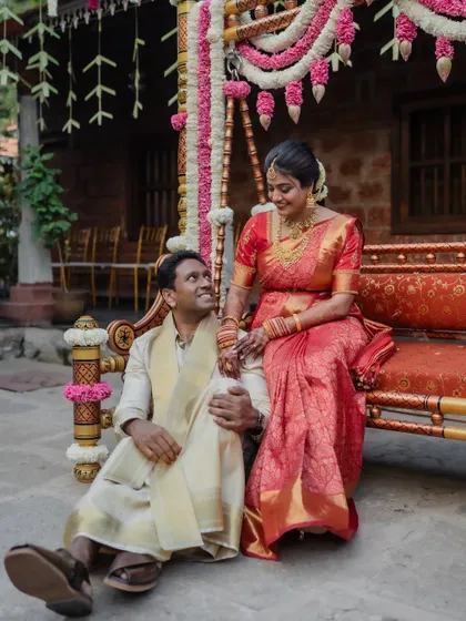A classic portrait of the groom in his traditional wedding attire, set against the charming backdrop of a heritage venue.