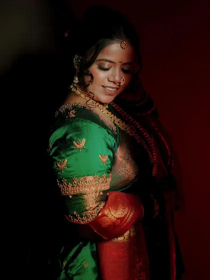 An artistic, low light portrait of the bride, her features softly illuminated, creating a moody and romantic feel.