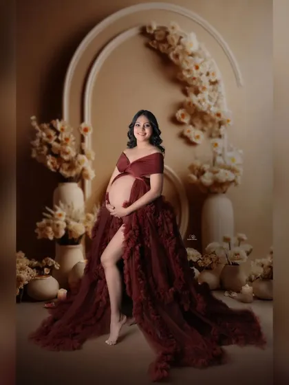 A powerful and graceful pose in a stunning ruffled gown. My studio sessions are designed to make you feel comfortable and beautiful, resulting in glamorous maternity portraits like this one.