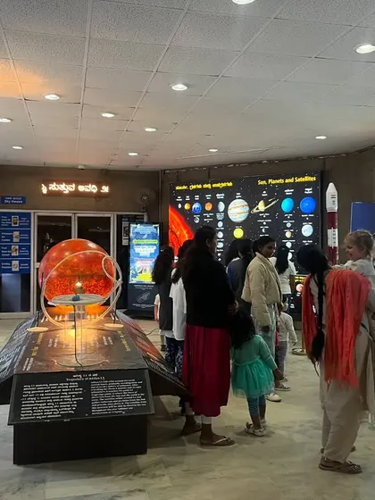 The wide-open space of the planetarium exhibit hall, filled with our students eagerly exploring the different displays.