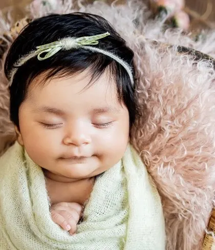 Even after giving us some adorable wide-eyed poses, this little one drifted off for the perfect sleepy shot. Newborn sessions include a mix of both awake and sleeping portraits.