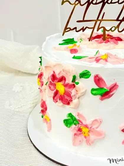 Another detailed shot of the painted flowers. Each petal is created with a palette knife, giving the cake a unique texture and depth.