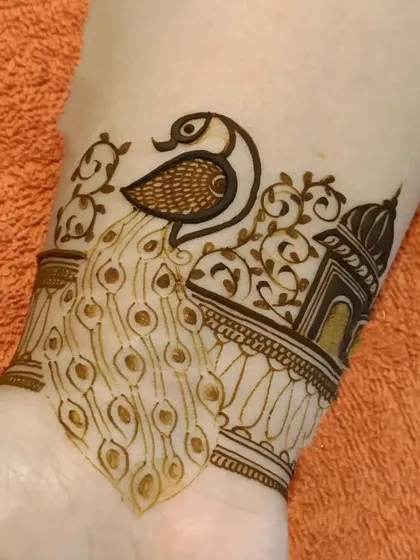 A close-up of a wristband design showing a peacock perched near a 'jharokha' or traditional window. These elements are hallmarks of my Rajasthani design style.