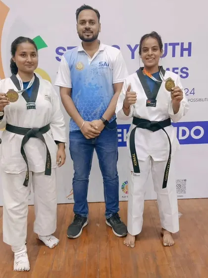 Our senior female athletes showcasing their gold medals at the Stairs Youth National Games. We provide specialized training for elite competitors aiming for national recognition.